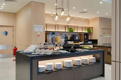 a kitchen with a counter with plates on it at Hotel Complex SamElyon in Samokov
