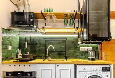 a kitchen with a sink and a stove at Paganini House close to Center and Rowing Canal in Plovdiv