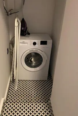 a washer and dryer in a small room at Apartment City by Wohnsol-mit Terrasse im Centrum in Sofia
