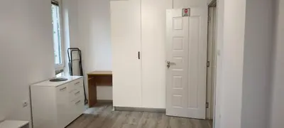 a white room with a window and a door at Two-Bedroom Apartment Lauta Park 6 Plovdiv in Plovdiv
