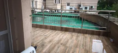 a swimming pool on the balcony of a house at Two-Bedroom Apartment Lauta Park 6 Plovdiv in Plovdiv
