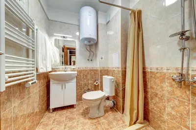 a bathroom with a toilet and a sink and a shower at Studio in Dream View Resort in Pamporovo