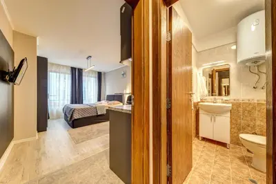 a bathroom with a sink and a toilet in a room at Studio in Dream View Resort in Pamporovo
