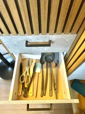 a drawer filled with knives and other kitchen utensils at Two Modern Apartments in One Building by SI Stay in Bansko
