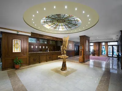 a lobby with a statue in the middle of a building at Apartment VIP in Hotel Sveti Spas in Velingrad