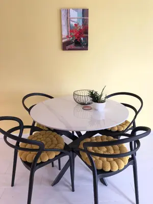 a white table with two chairs and a table with a plant on it at Sofia 3-Bedroom Mountain Family Apartment with Free Parking in Sofia