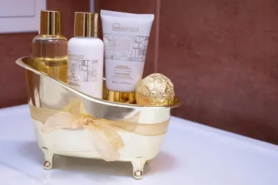 a gift basket with three bottles of cosmetics at Apartment Bee Happy, Pchelinski Bani,Hot mineral water in Pchelin