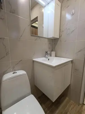 a bathroom with a white toilet and a sink at 20th Residence Studio 11 in Sofia