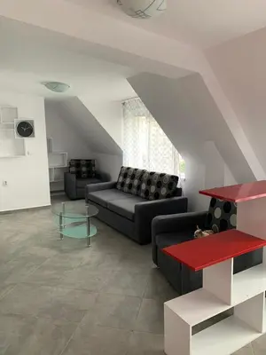 a living room with a couch and a table at Stylish 1BR near Centre in Sofia
