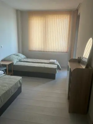 a room with two beds and a window at Семеен хотел Струма in Boboshevo