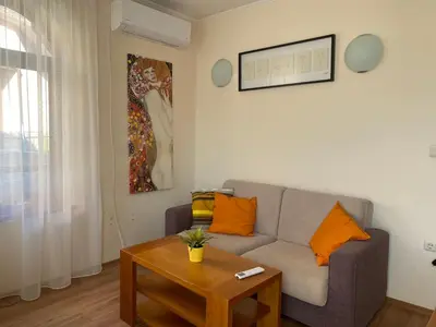 a living room with a couch and a table at Cedar Lodge Apartament - Gondola in Bansko