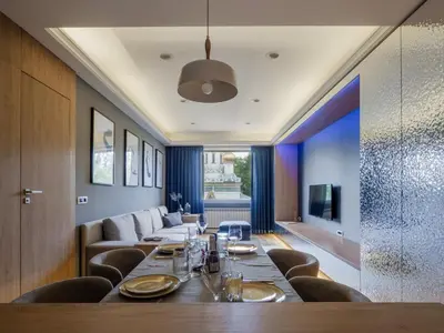 a dining room with a long table and chairs at Sofia Central View Loft in Sofia