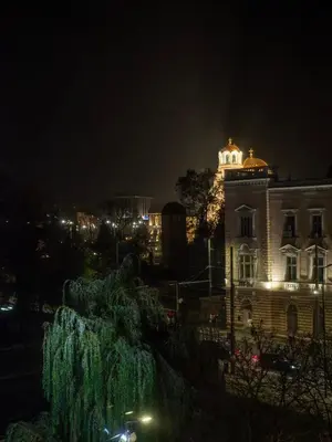 a building with lights on top of it at night at Sofia Central View Loft in Sofia
