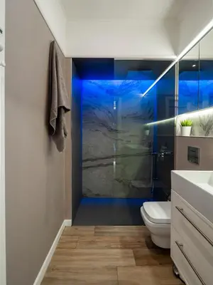 a bathroom with a shower with a toilet and a sink at Sofia Central View Loft in Sofia