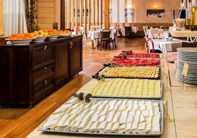 a buffet line with several different types of food at Green Life Private Apartment D27 in Bansko