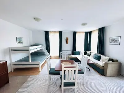 a living room with a bunk bed and a couch at Bansko 3 Ski To Door Apartment in Bansko