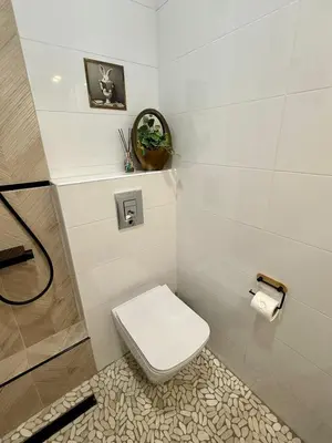 a bathroom with a toilet and a toilet paper roll at Apartment Juliet in Sofia