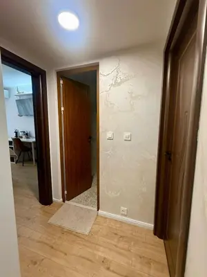 an empty room with a door and a hallway at Apartment Juliet in Sofia