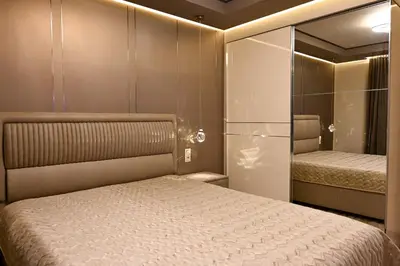 a bedroom with a bed and a glass wall at All Seasons Apartment 2 in Sofia