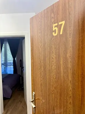 a wooden door with the number on it in a bedroom at Dream Apart - Iceberg in Pamporovo