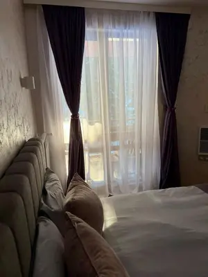 a bedroom with a bed and a large window at Dream Apart - Iceberg in Pamporovo