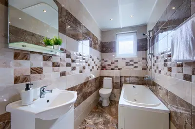 a bathroom with a sink and a toilet and a tub at Rila North Samokov in Samokov