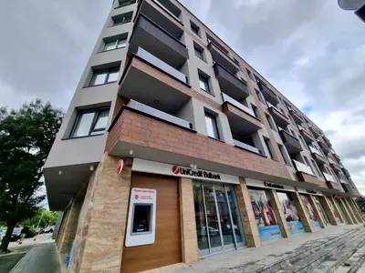 a building on a street with a store at Flex loft in Sofia