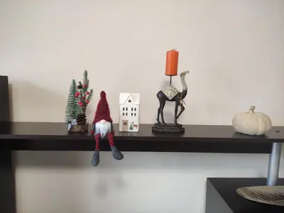 a shelf with a santa clause and decorations on it at Апартамент за гости НИКОЛОВА in Plovdiv