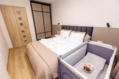 a bedroom with a large bed in a room at City Home Sandanski in Sandanski