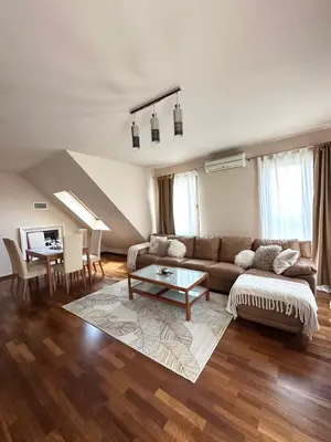 a living room with a couch and a table at Flower garden in Lozenetz by 7th Sence in Sofia