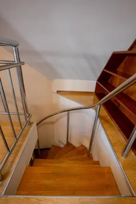 a staircase with a glass railing and wooden floors at Flower garden in Lozenetz by 7th Sence in Sofia