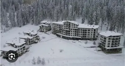an aerial view of a resort in the snow at Аppartment Dreams in Pamporovo