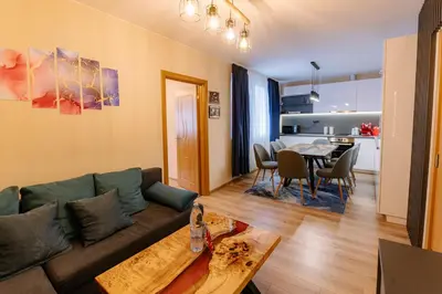 a living room with a couch and a table at 1 minute to main Street Grafa, NDK, FREE Parking, 3BDR in Sofia