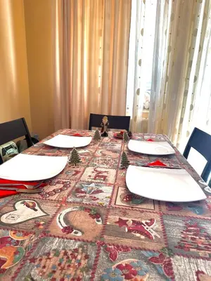 a dining room table with christmas decorations on it at Ava Apartment Pamporovo in Pamporovo