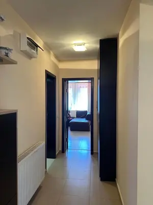 a hallway with a door leading to a living room at Ava Apartment Pamporovo in Pamporovo
