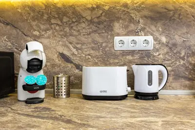 two coffee machines sitting on a kitchen counter at Top-Floor Flat with Balcony by Flat Manаger in Plovdiv