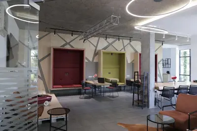 a lobby with tables and chairs in a building at Apartment with an amazing view - near Bansko in Razlog