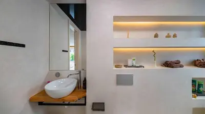 a white bathroom with a sink and a mirror at Unique Designer Retreat | Mins to Gondola - Patio! in Bansko
