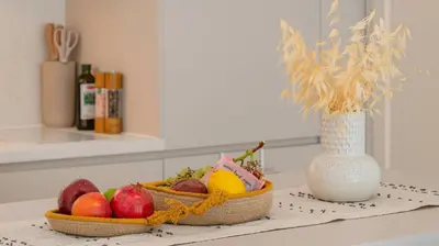 two baskets of fruit on a counter with a vase at Unique Designer Retreat | Mins to Gondola - Patio! in Bansko