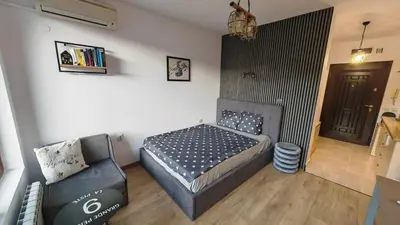 a small bedroom with a bed and a couch at Mountain View Studio Borovets Hills A60 in Borovets