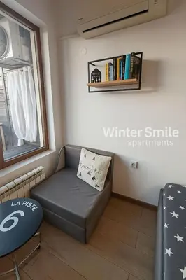 a small living room with a couch and a window at Mountain View Studio Borovets Hills A60 in Borovets