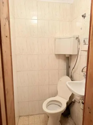 a bathroom with a toilet and a sink at Cozy two room maisonette apartment in Samokov