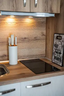a kitchen counter with a counter top with a sink at Best Central Lux Studio in Bansko