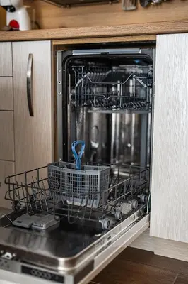 a dishwasher with a dish rack inside of it at Best Central Lux Studio in Bansko