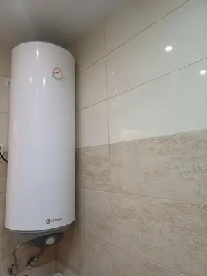 a water tank in the corner of a bathroom at Ktt house in Plovdiv
