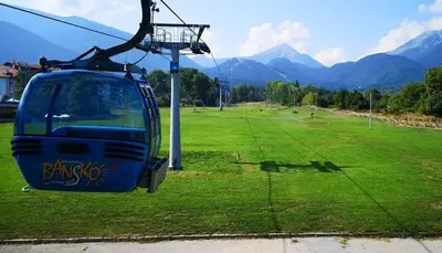a gondola ride in a field of green grass at Best Central LUX Studio in Bansko
