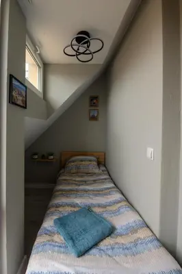 a bed with a blue blanket in a room at Comfy&Chick Central Apartment, Free Street Parking in Blagoevgrad