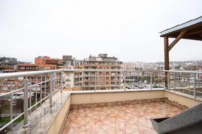 a balcony with a view of a city at Comfy&Chick Central Apartment, Free Street Parking in Blagoevgrad