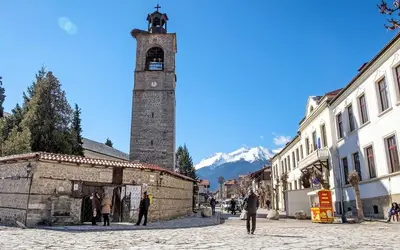 a clock tower in the middle of a street at Best Central LUX Studio in Bansko