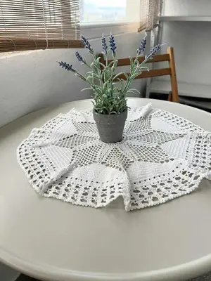 a white table with a potted plant on top of it at Angels Loft opposite The Mall in Sofia